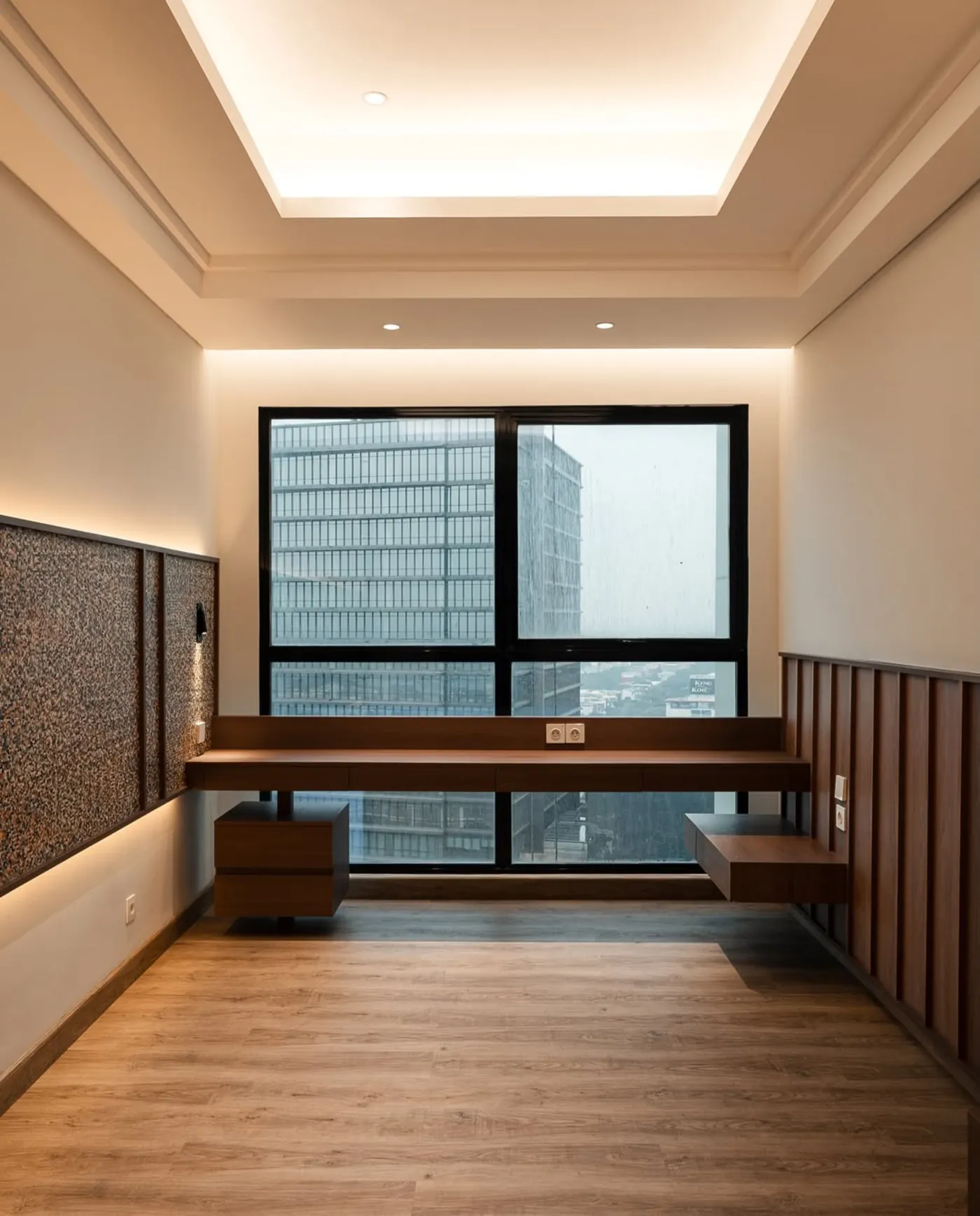 Bedroom with a floating desk under a window and wood panelled walls