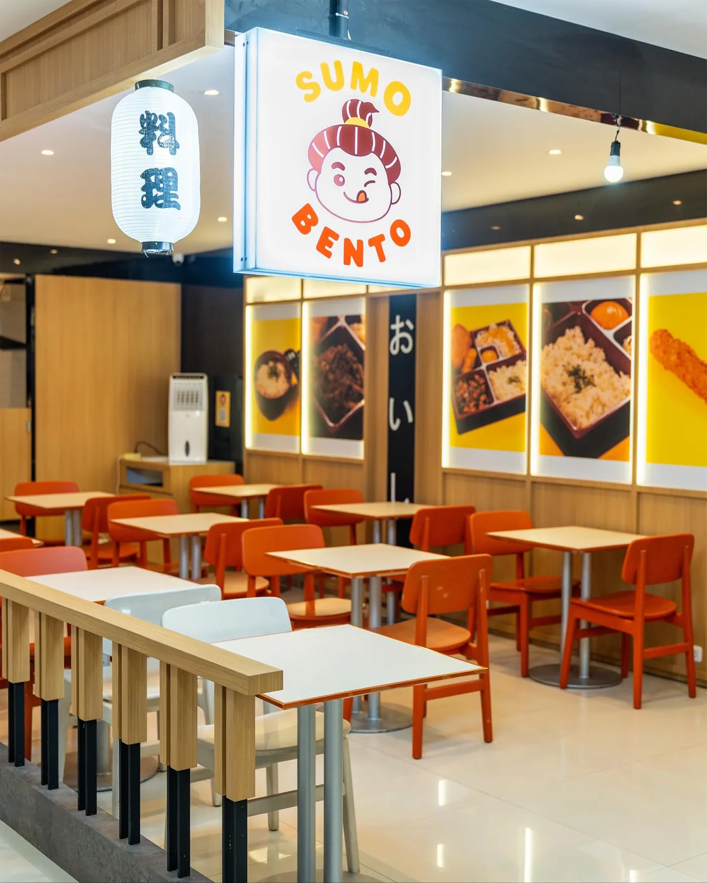 Sumo Bento tenant with its lit sign and dining seats